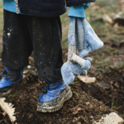 A child with his toy at war
